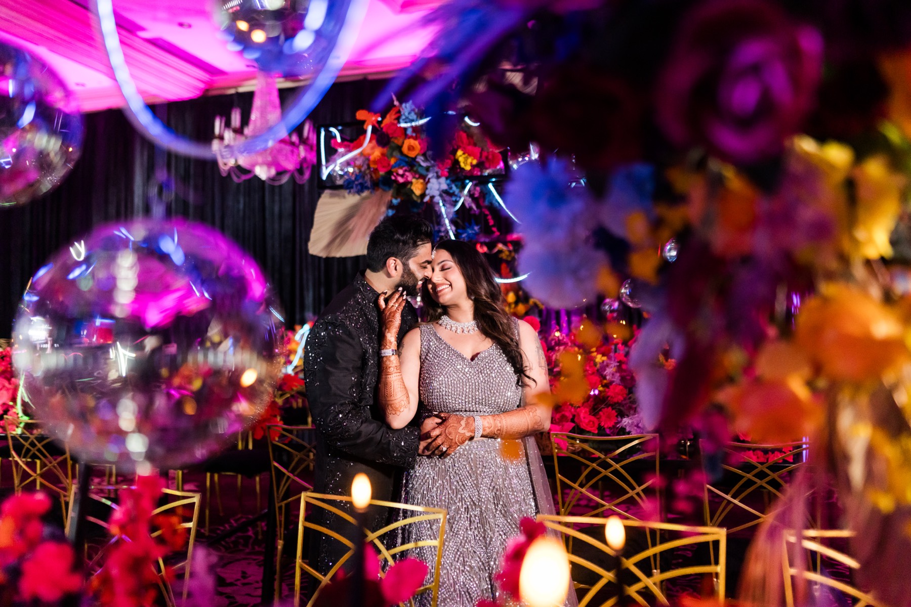 Couple posing with a scenic wedding venue backdrop